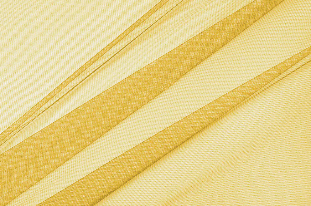 Tulle Soepel 300cm. Goudgeel
